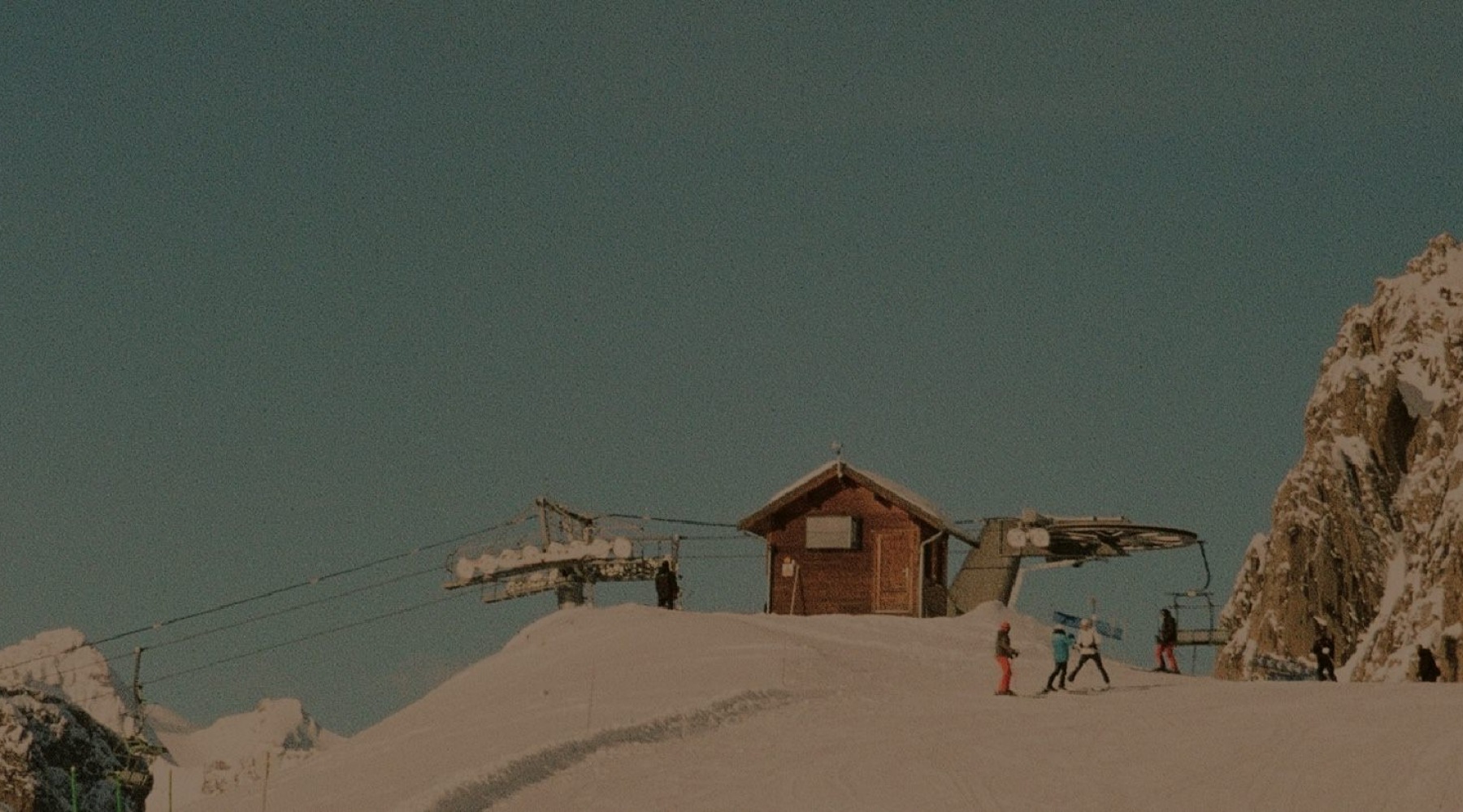 a cabin on a snowy mountain