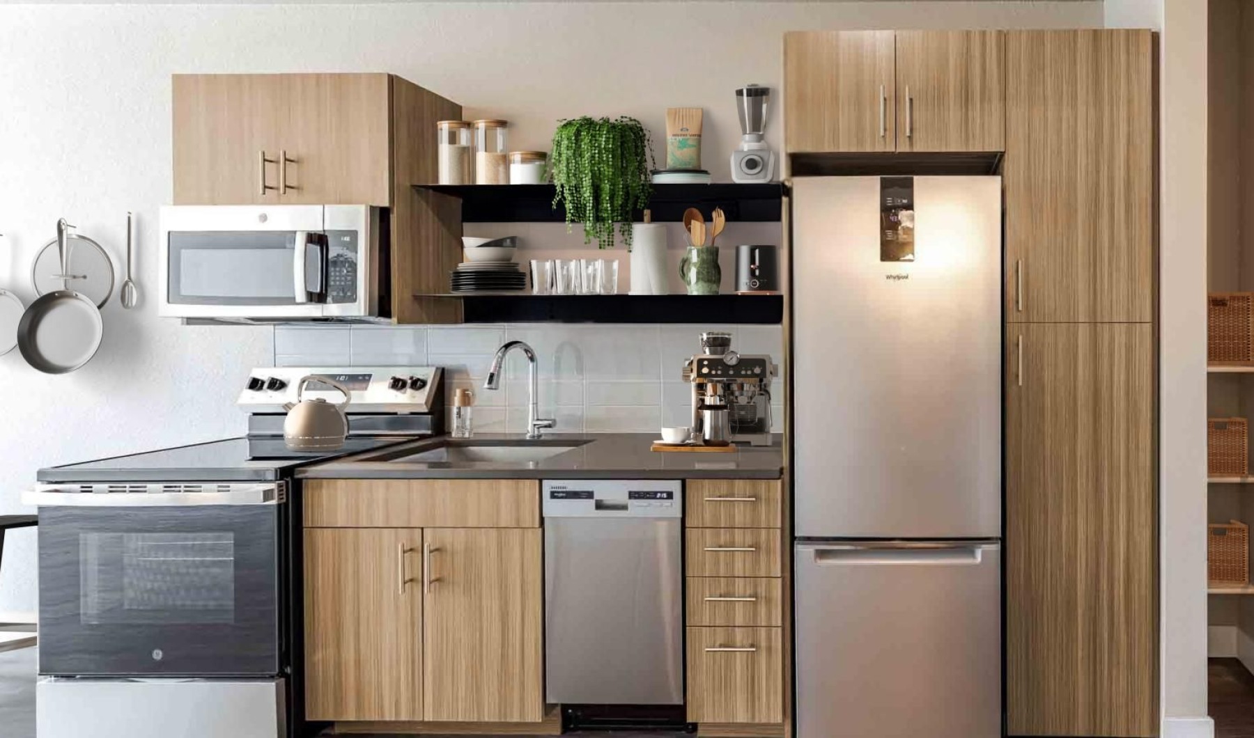 a kitchen with a refrigerator and microwave